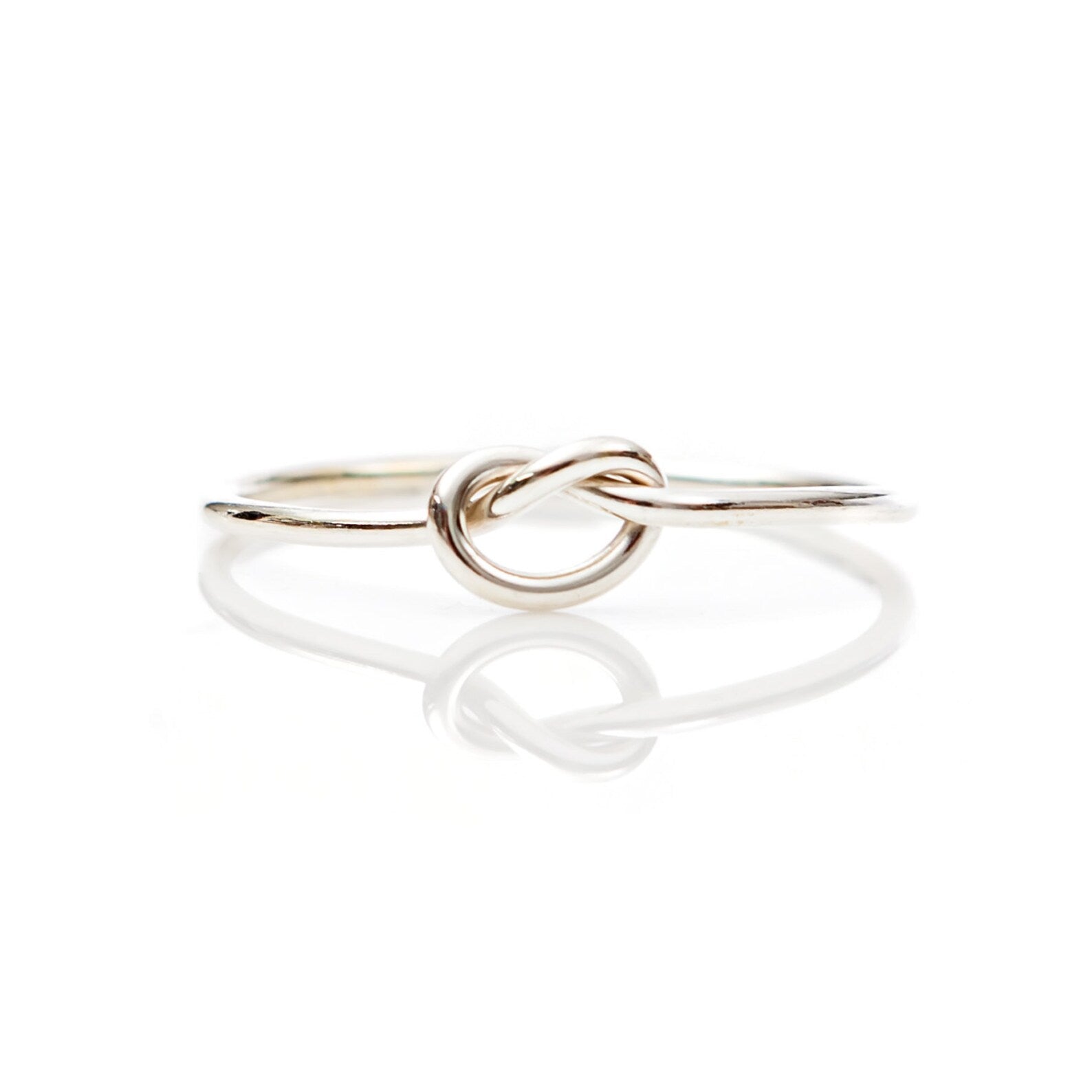 Dainty knot clearance ring